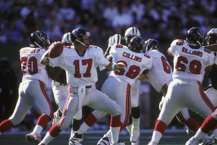 DeBerg throwing a pass during his record-setting start.